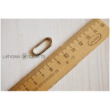 Metāla ovāls sudraba krāsā - 2.5cm - Noliktavas iz