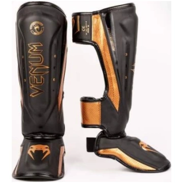 Venum Elite Evo Shinguards - melni/bronzas krāsas 