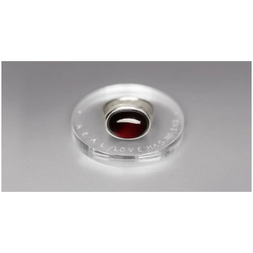 "Real love has.." silver ring with garnet · VERUS 
