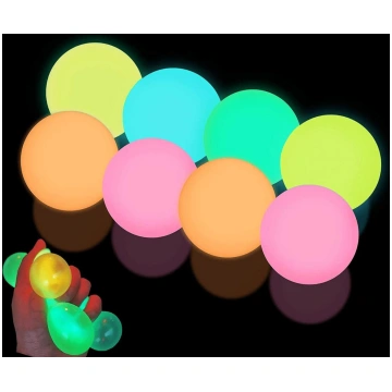 Set of 4 glow-in-the-dark squishy balls—soft, stre